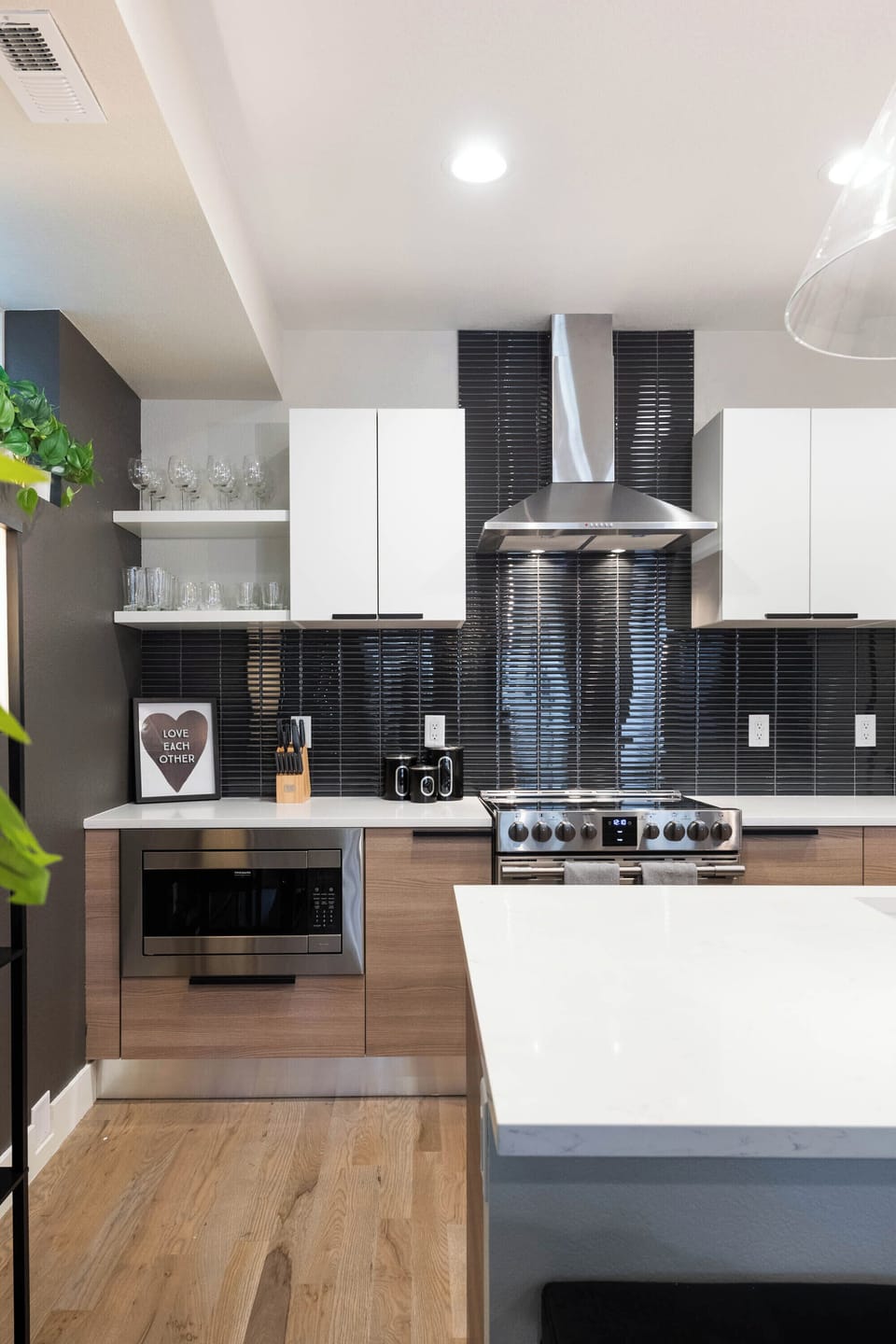 Large Kitchen with electric 6-burner stove, dishwasher, island, and coffee bar