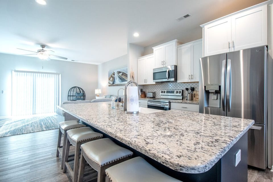 Fully equipped kitchen with generous counter space and island seating