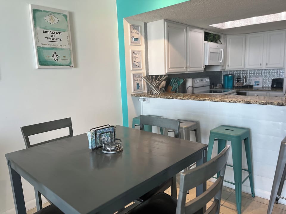 Dining area with table seating plus additional bar seating.