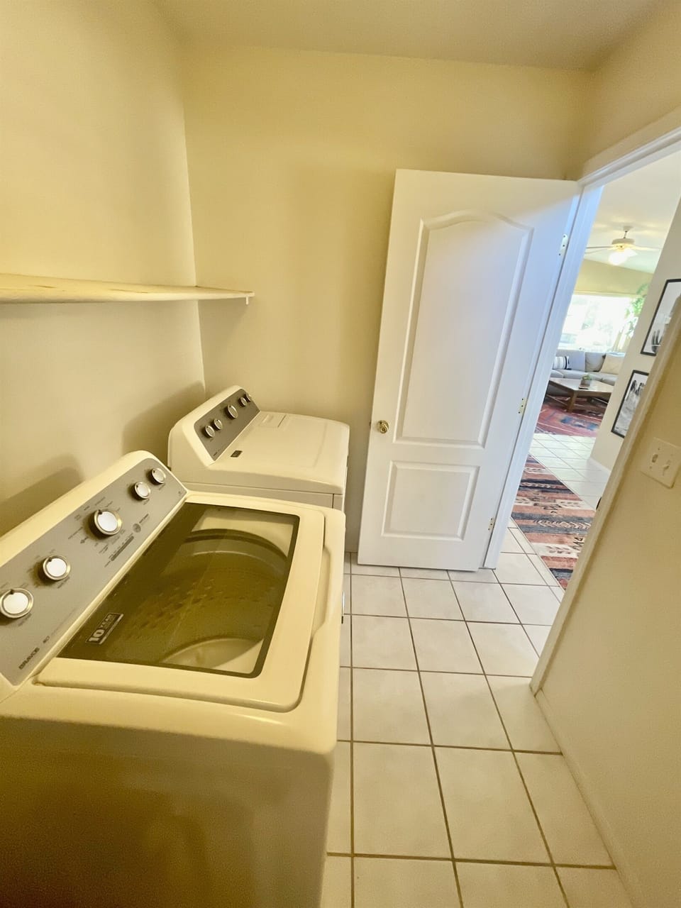 Enjoy the convenience of a private laundry room with a full-size washer and dryer