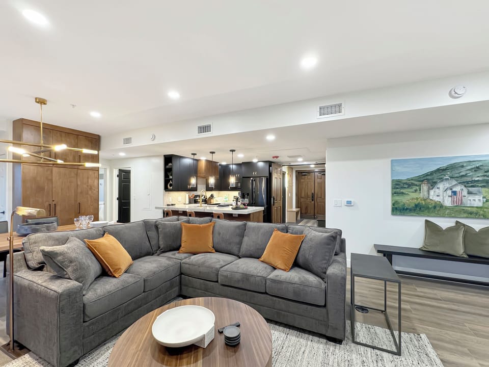 The spacious living area offers comfortable seating for everyone to enjoy quality time together.
