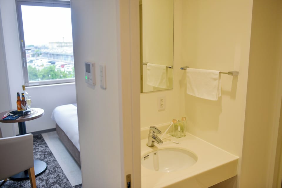 Separate tub and shower, free toiletries, hair dryer, slippers
