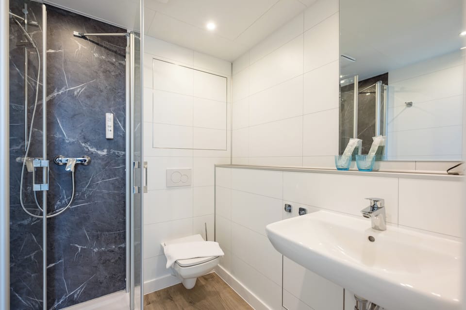 Family Twin Room, Balcony, Partial Sea View | Bathroom | Shower, hair dryer, towels, soap