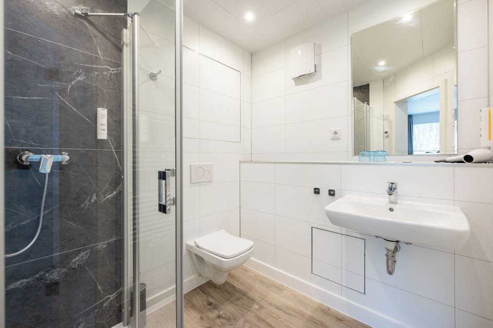 Comfort Double Room, Balcony, Partial Sea View | Bathroom | Shower, hair dryer, towels, soap