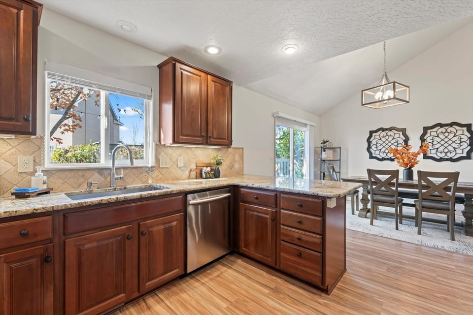 Whip up your favorite meals in this fully equipped kitchen with a bar for extra seating, all while staying connected to the dining area for easy meals and good conversation.