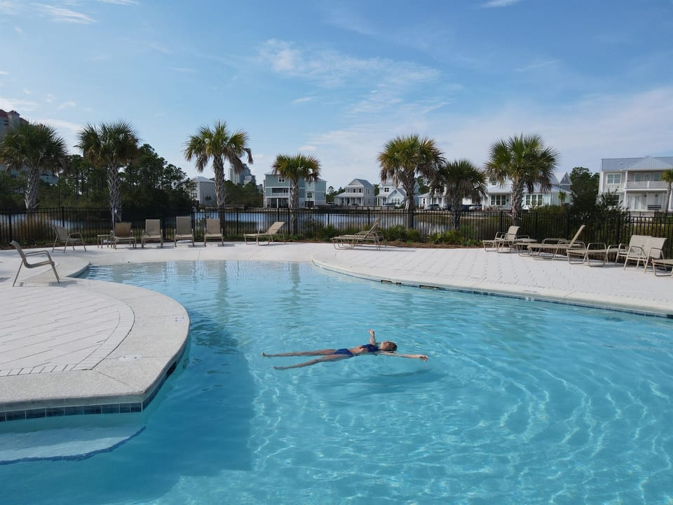 Enjoy the resort-style zero-entry swimming pool on a hot summer day, or relax with your favorite book in one of the many lounge seats.  Have your lunch in the covered area nearby.  All without the crowds of a high-rise condo.
