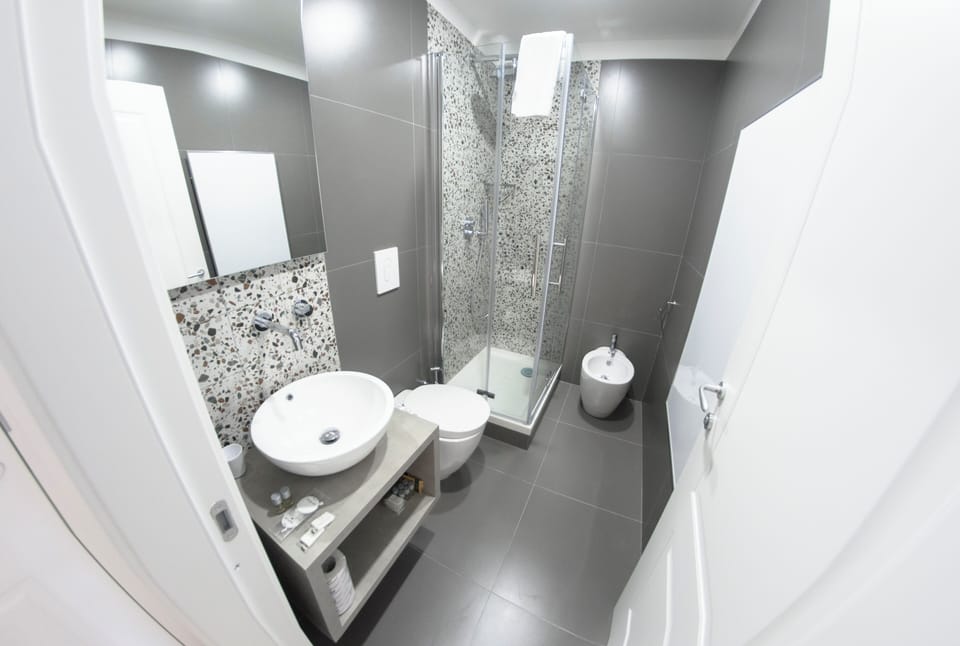 Superior Studio Suite, City View | Bathroom | Shower, hair dryer, towels, soap