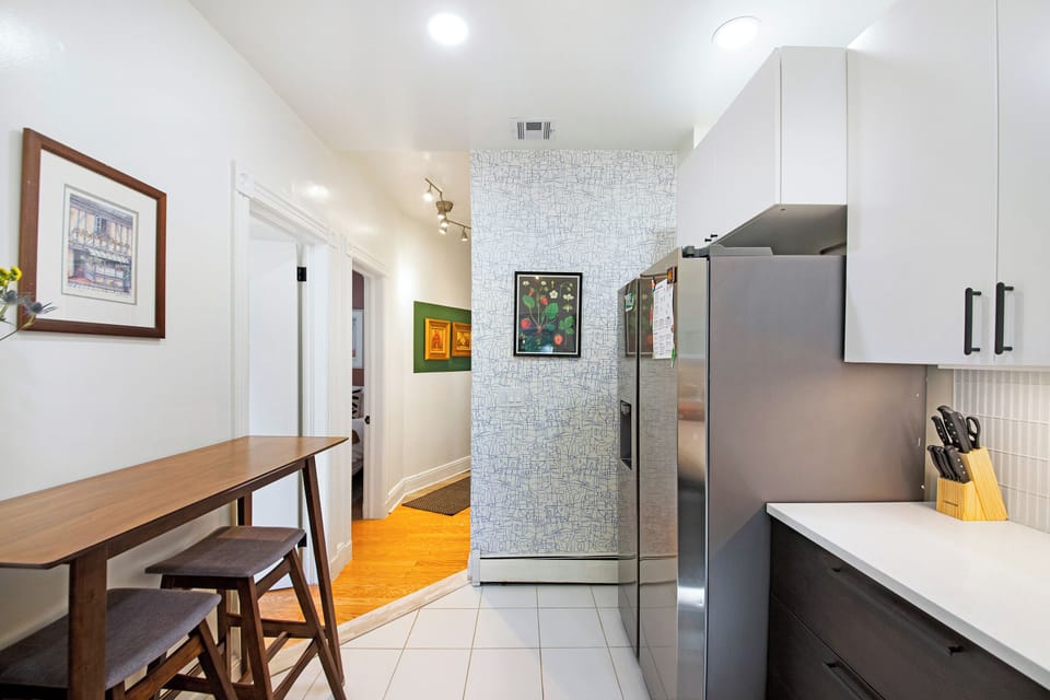 Kitchen featuring breakfast nook as well as new fridge w/ ice maker