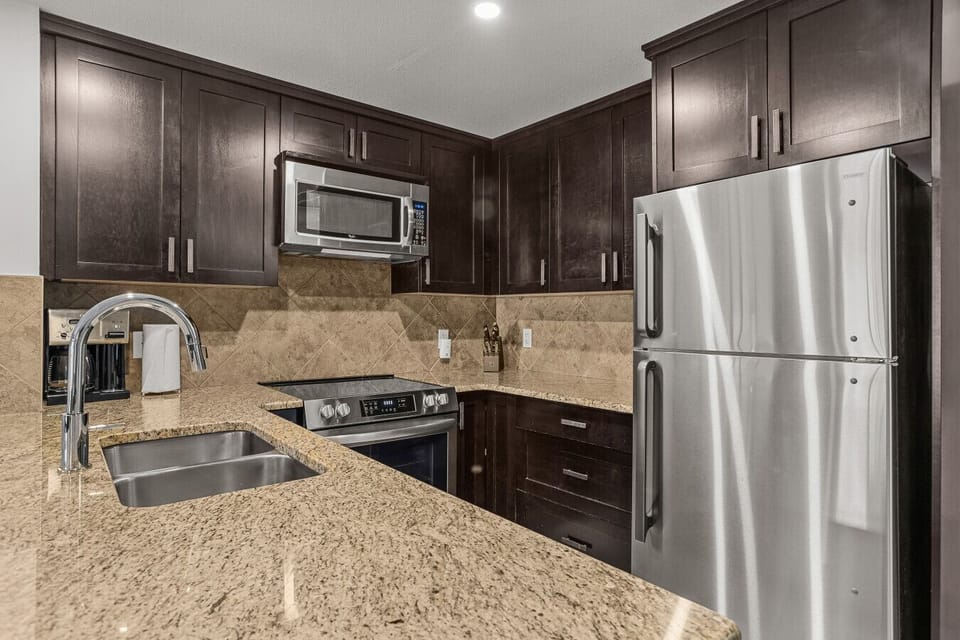 Quartz countertops and stainless steel finishes