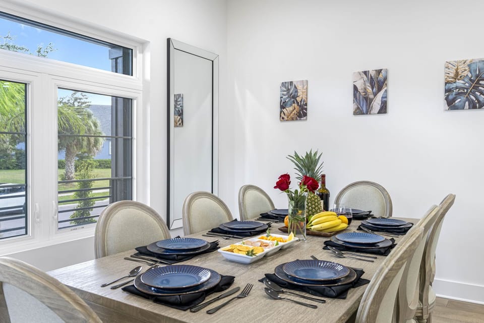 The kitchen and dining spaces are both stylish and functional, with elegant lighting and décor that add to the overall ambiance of the home.