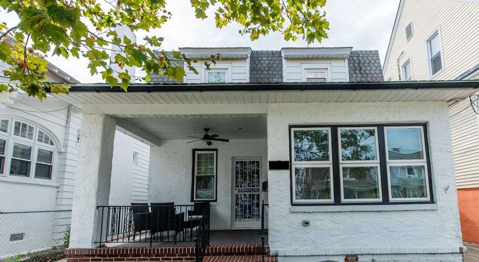 Cozy front porch comes with a salty sea breeze