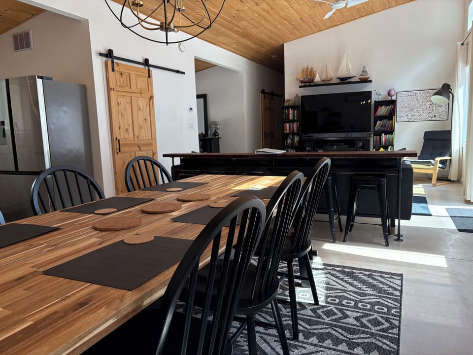 Modern open concept area. Extra seating at kitchen island and side counter table
