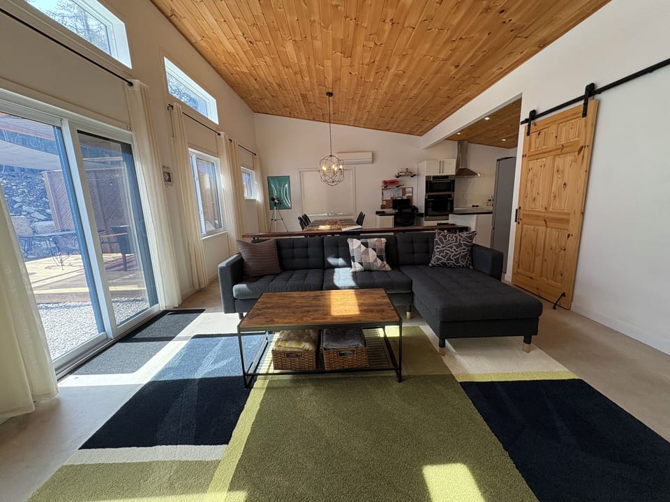 Modern open concept living area. Includes walkout to backyard / patio