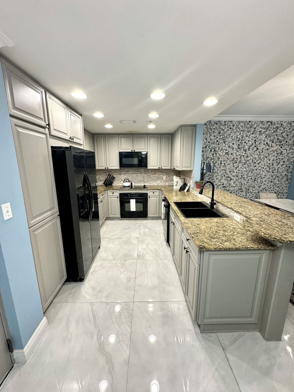 Renovated kitchen w/new floors, new refrigerator, microwave dishwasher/ sink.
