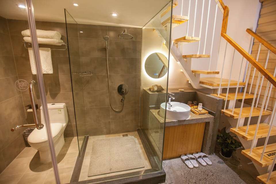 Family Triple Room, Balcony, Mountain View | Bathroom | Hair dryer, slippers, towels, soap