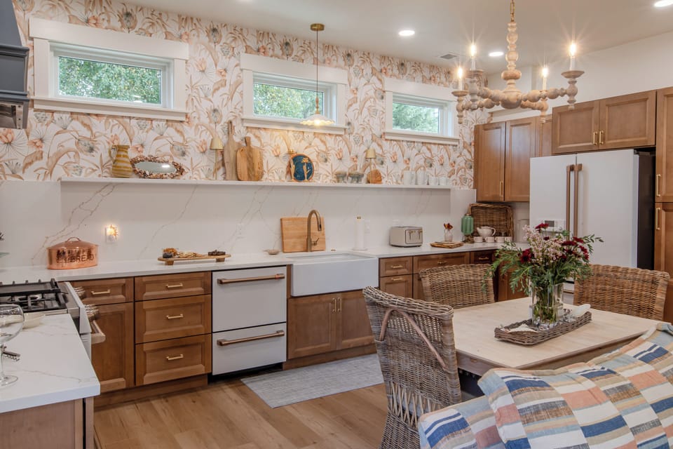 The large kitchen has lots of surface and cupboard space for storage and prep