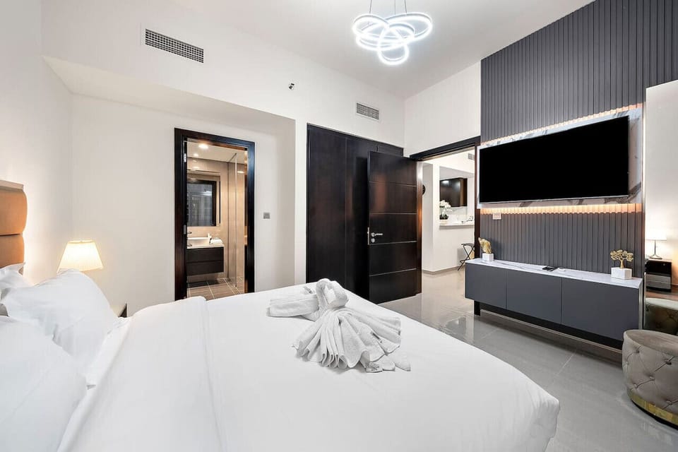 Bedroom Retreat: Sleek design with modern touches and plush linens for serene nights ahead!
