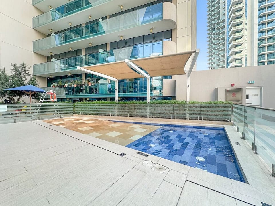 Poolside Paradise: Dive into luxury with a stunning pool and sleek outdoor lounge area!