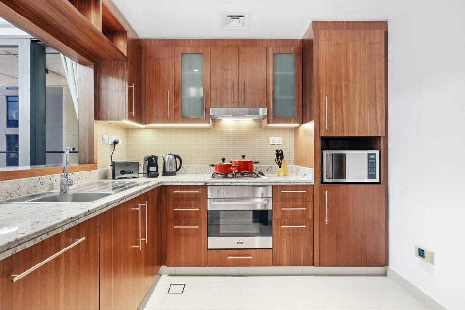 Gourmet Kitchen: Cook like a pro with modern appliances and sleek wooden cabinetry!