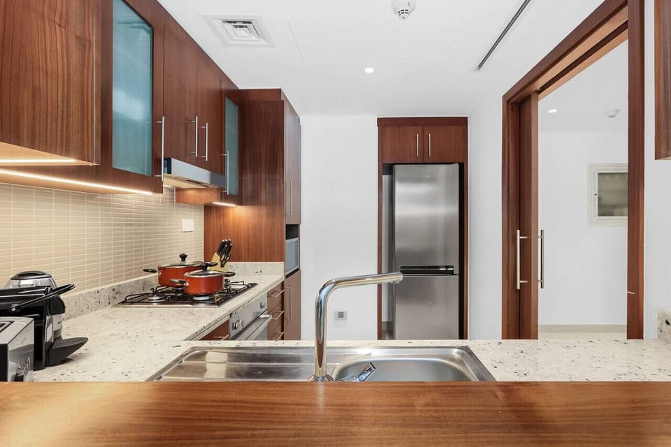 Kitchen: Sleek cabinetry and modern appliances await culinary adventures in this stylish kitchen!