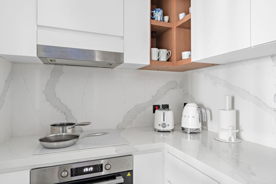 Kitchen: Sleek marble surfaces and stylish appliances await your culinary adventures!