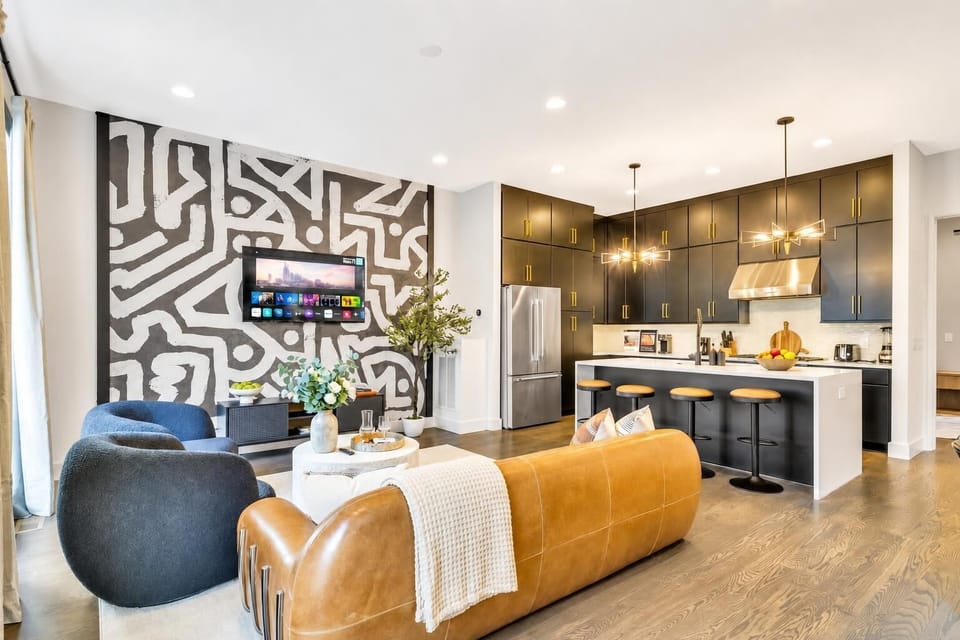 Open kitchen and living room keep your whole group talking, even while someone's mixing drinks at the island. Four bedrooms mean nobody sleeps on a couch