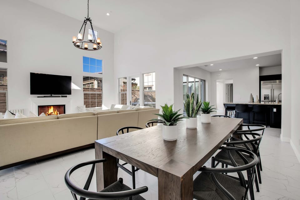 Open dining area flowing seamlessly into living room and kitchen