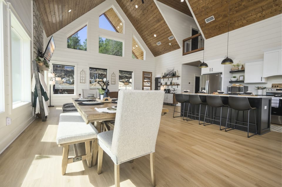 Enjoy sunlit mornings in this charming cabin featuring large windows throughout. Nature awaits just outside your door