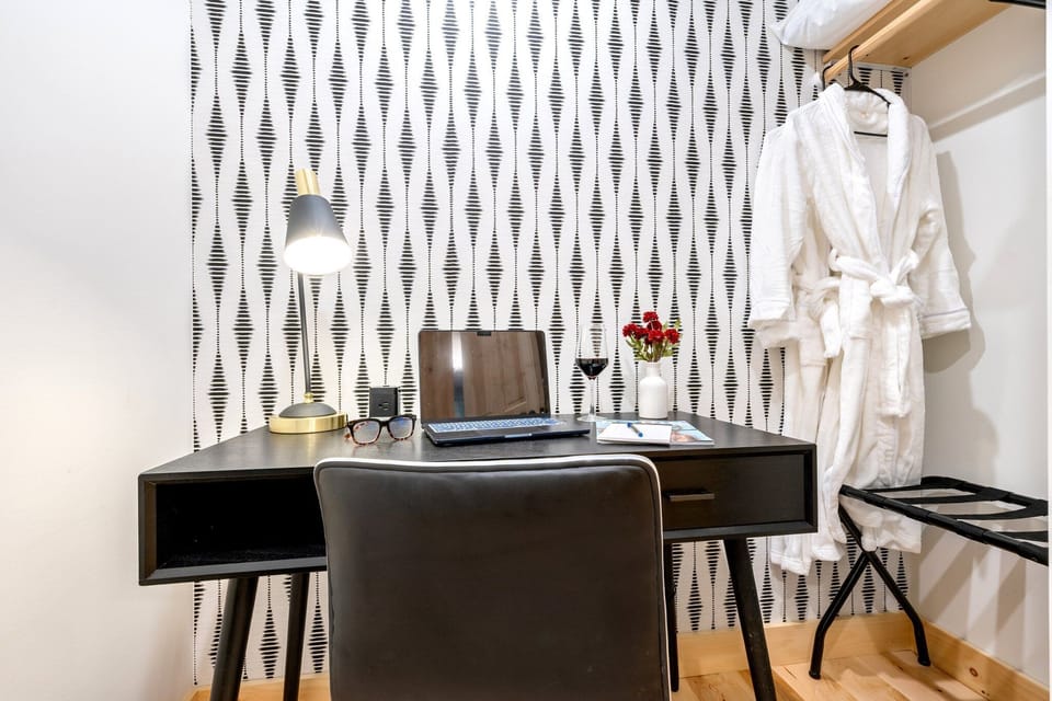 Work from the comfort of your master suite with this elegant desk setup.