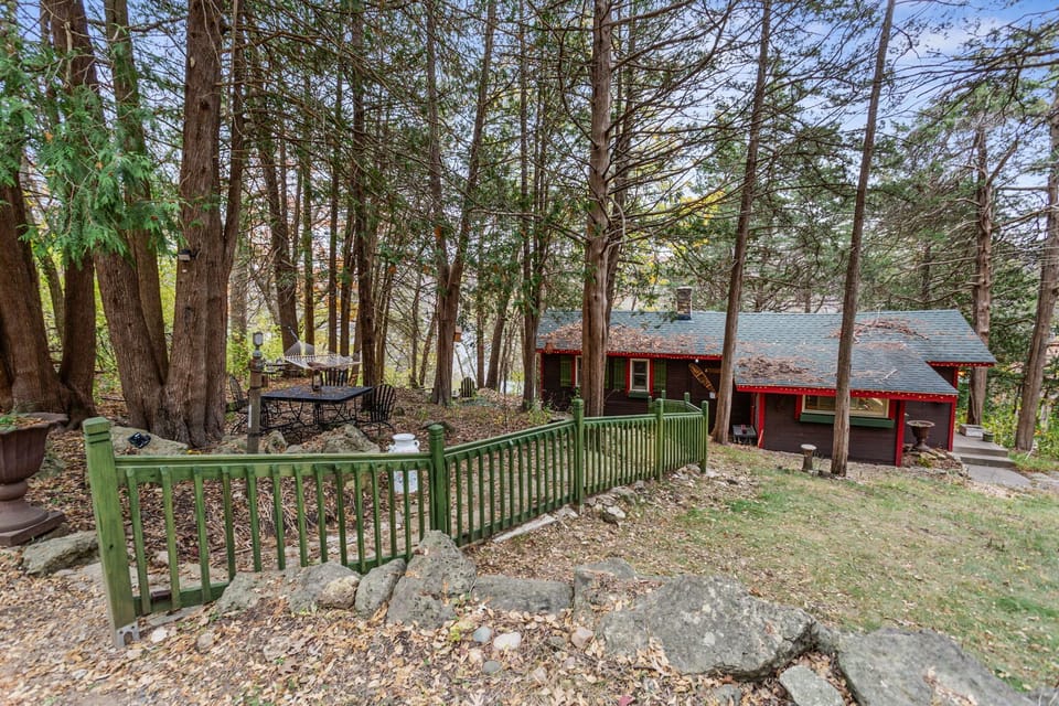 Cabin front... LOTS  of old natural stone steps down to cottage entrance.  
