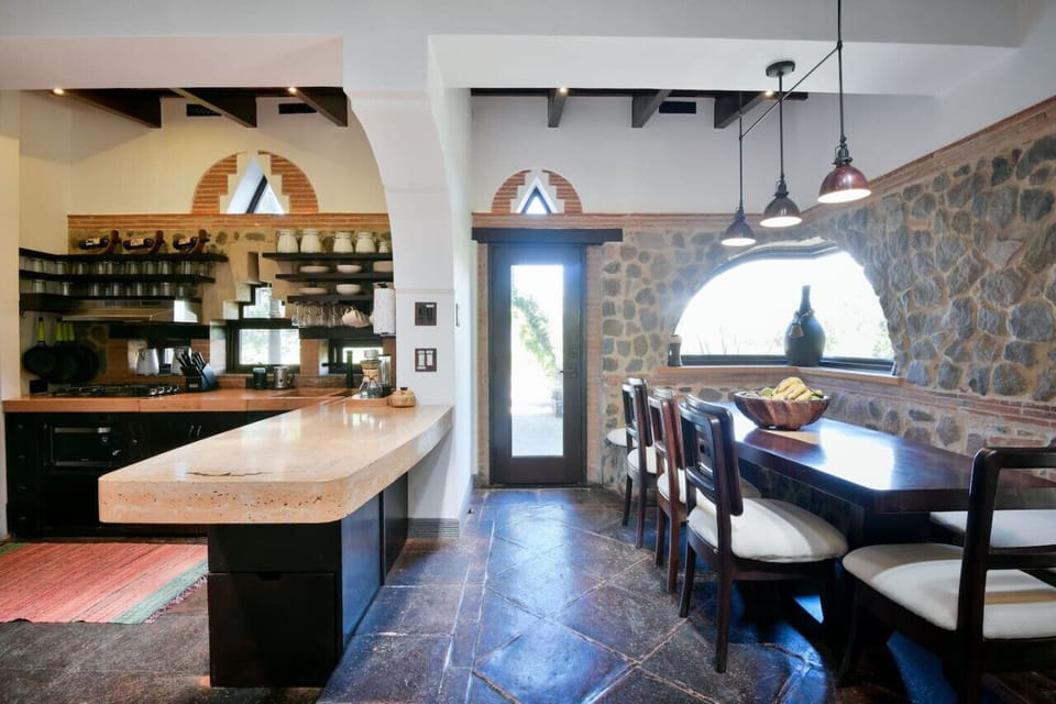 Kitchen and dining area with door to outside patio area.