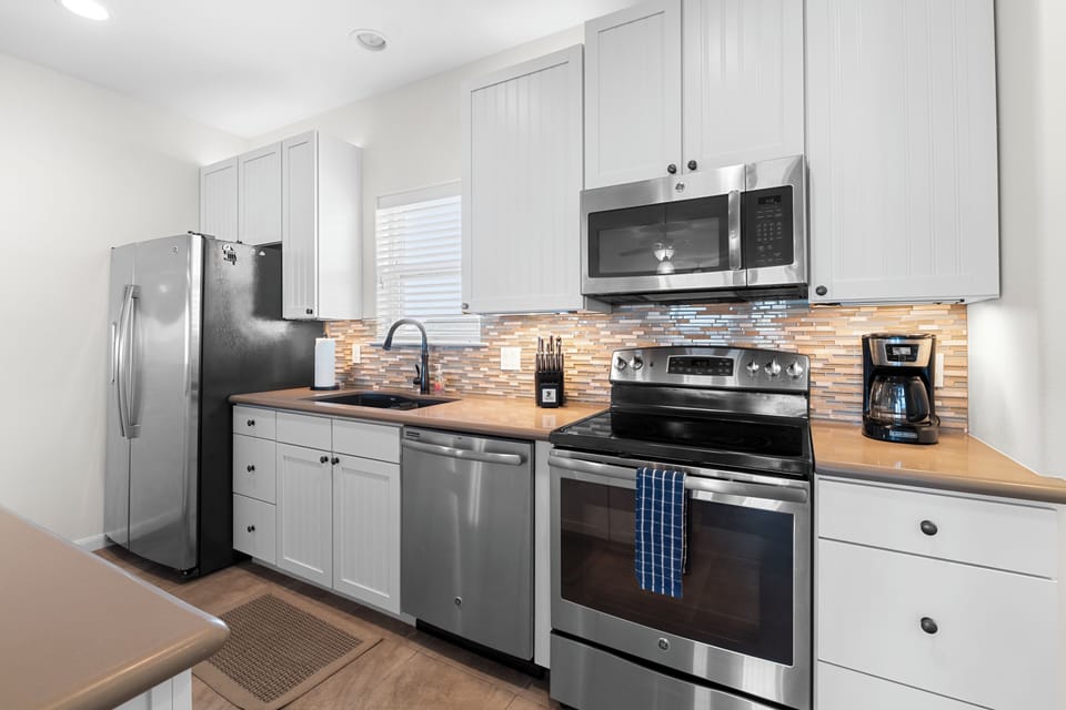 Modern kitchen with stainless steel appliances and all essentials!
