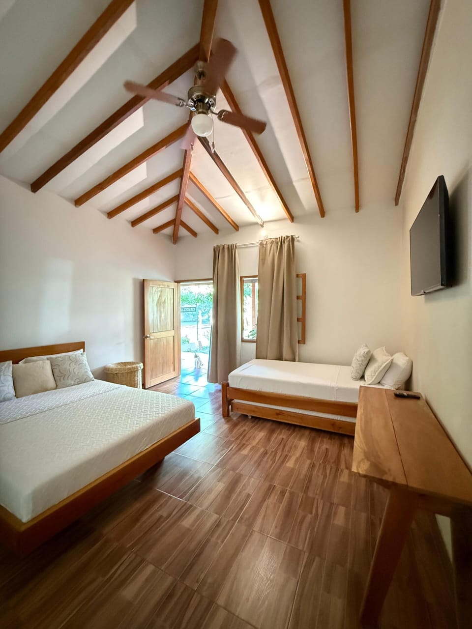 Family Room | Egyptian cotton sheets, premium bedding, desk, blackout drapes