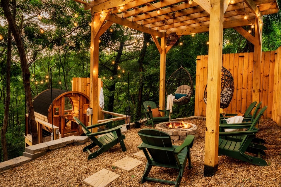 Unwind by the firepit under the pergola, with the Scandinavian sauna and outdoor shower steps away. Serenity awaits in the woods!