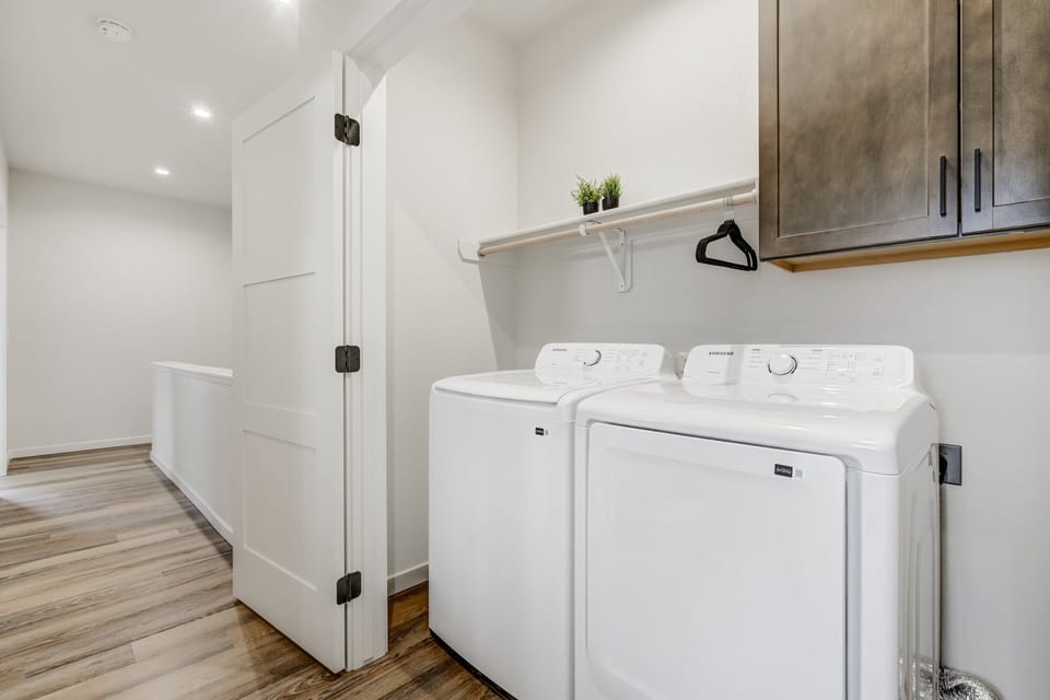 Upstairs Laundry Room with full washer/dryer