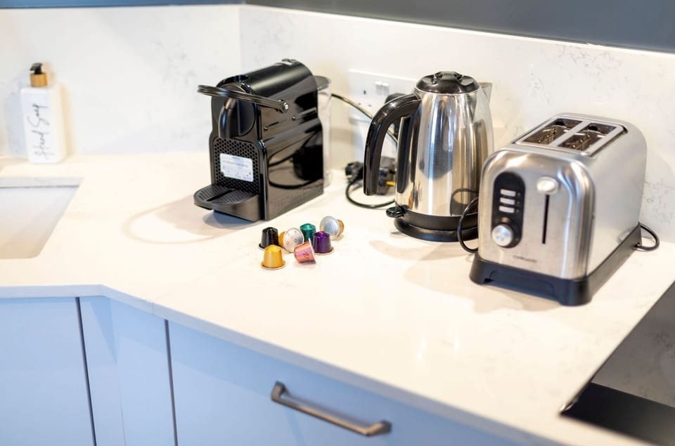 Fully equipped kitchen with amenities such as a dishwasher, Nespresso machine, and induction hob