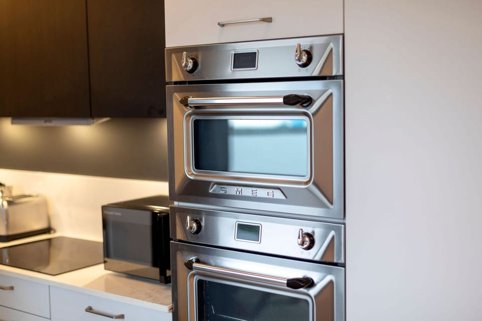 Fully equipped kitchen with amenities such as a dishwasher, Nespresso machine, and induction hob