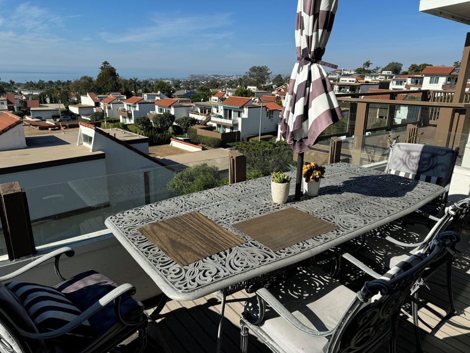 Ocean view upper deck with table, seating for 6, umbrella and BBQ grill 