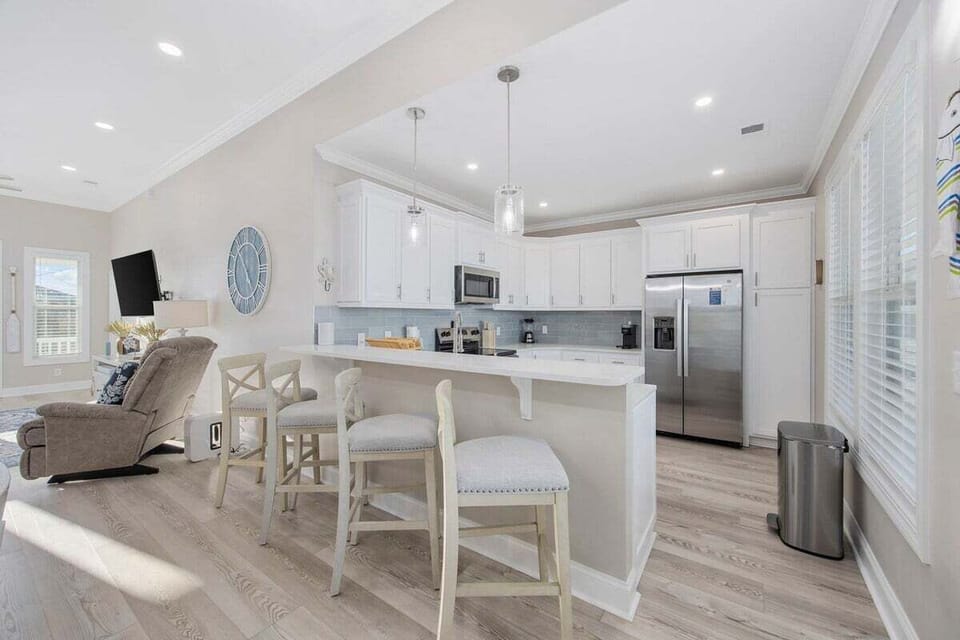 Share meals and memories in this inviting dining space, where a large table and comfortable seating bring the whole group together in style