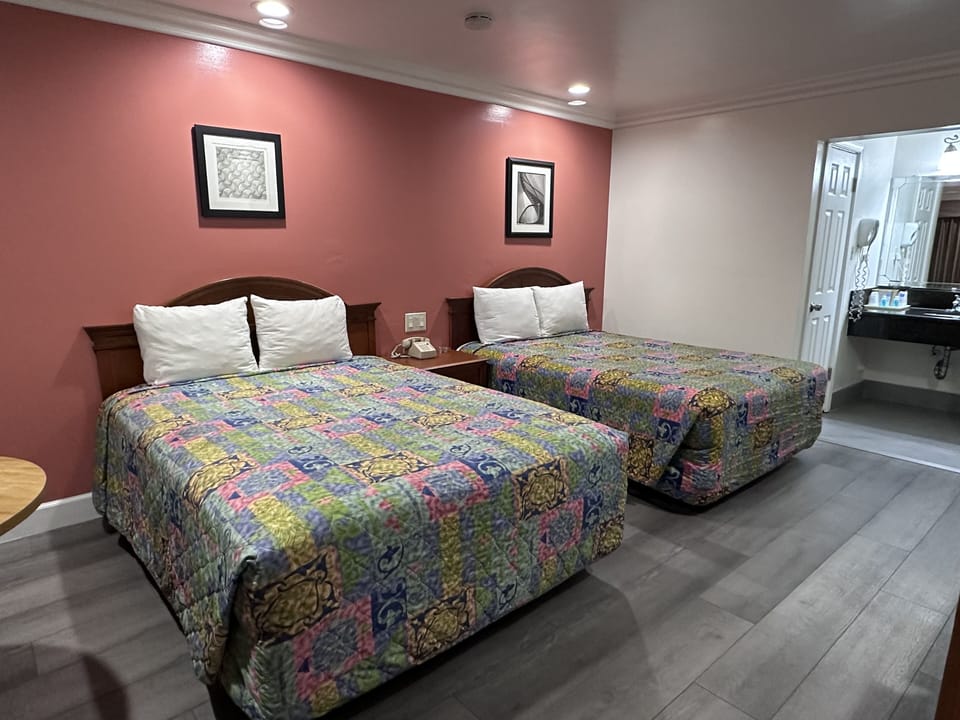 Standard Room, 2 Queen Beds | Desk, blackout drapes, free WiFi, bed sheets