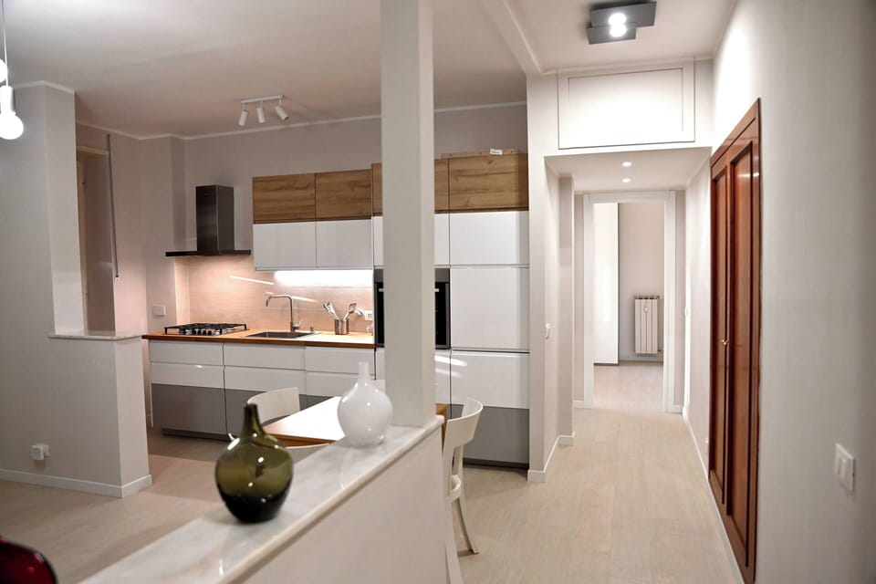 Apartment, Balcony, City View | Living area | 32-inch flat-screen TV with cable channels