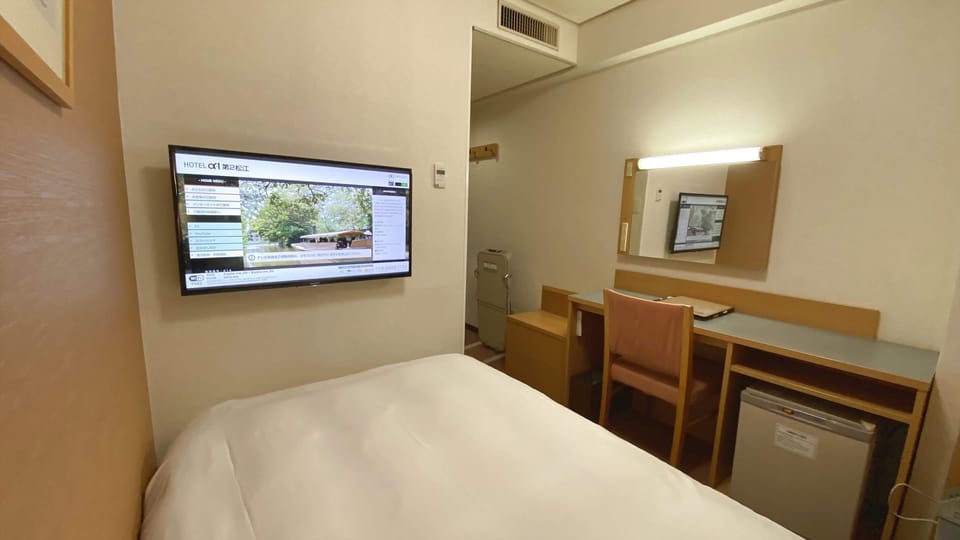 Down comforters, desk, WiFi (free), bed sheets