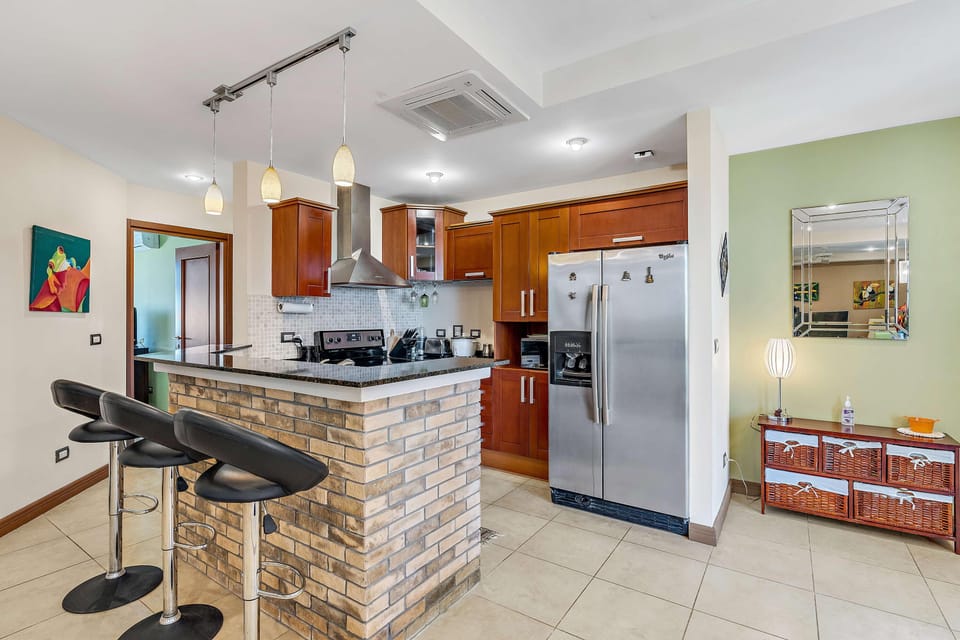 Enjoy a drink while cooking in the kitchen.