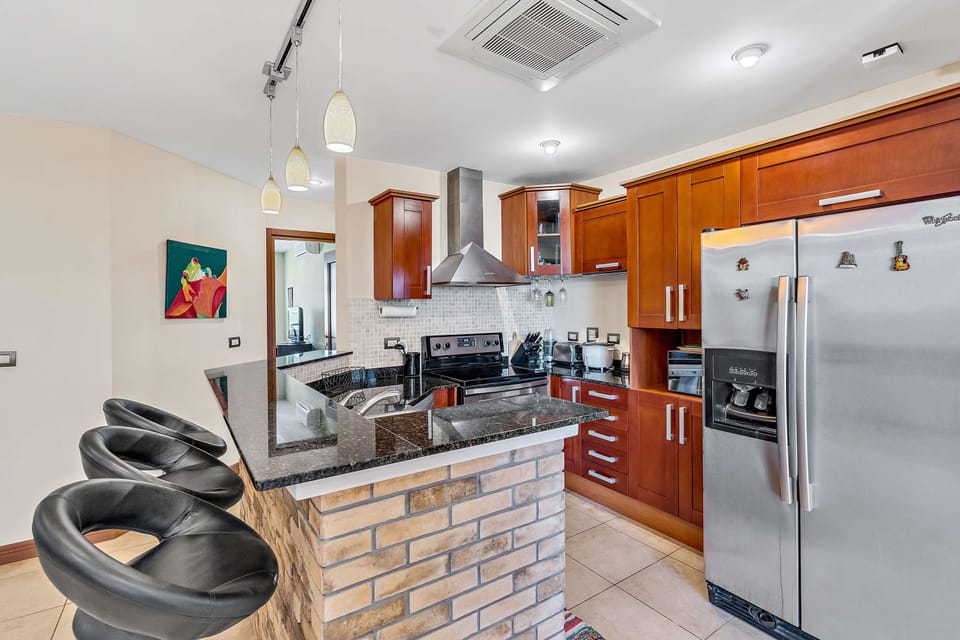 The unit has a full kitchen for you to cook in. You will find an electric stove and oven, a dishwasher, blender, coffee maker and more.