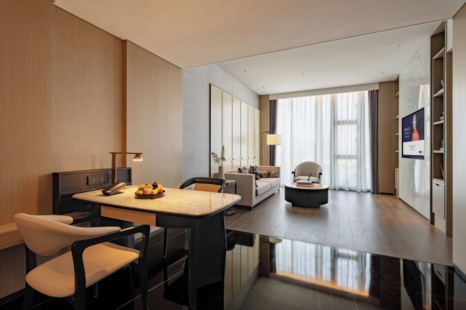 Deluxe Suite, 1 King Bed | Premium bedding, down comforters, in-room safe, laptop workspace