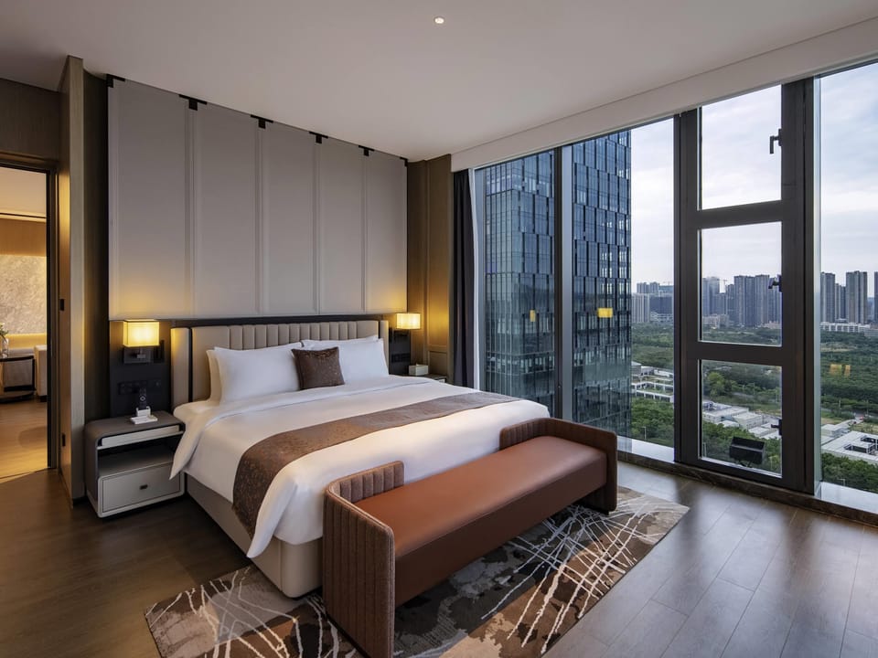 Premium bedding, down comforters, in-room safe, laptop workspace