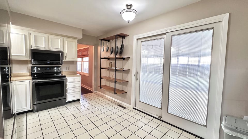 Through the kitchen is access to the sun room and back deck. 