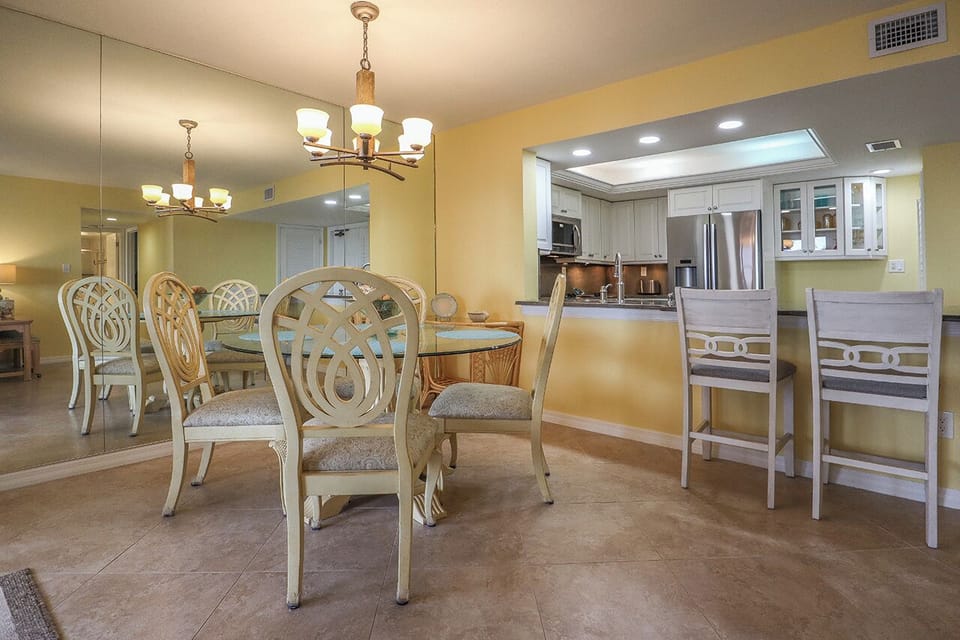 Dining Area has glass topped table for 4