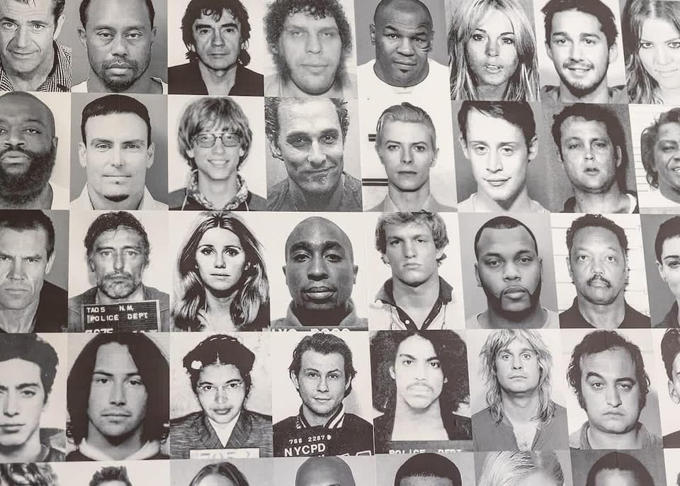 2nd floor. Celebrity mugshot wall in living room