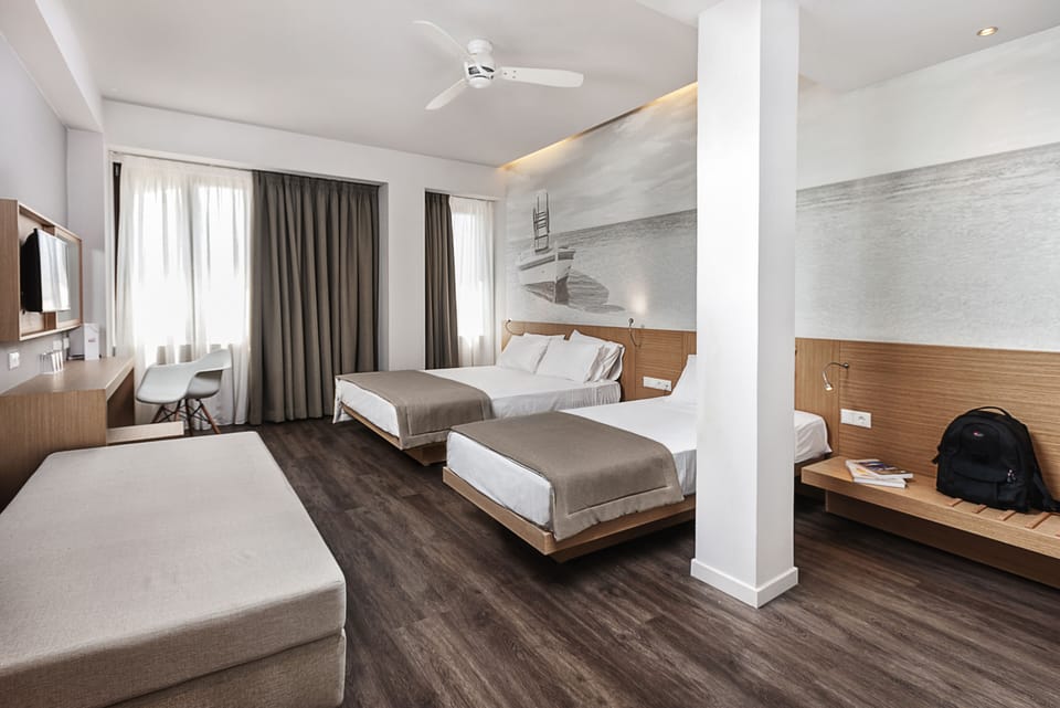 Quadruple Room | Premium bedding, in-room safe, individually decorated, desk